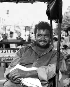 Indyword.com - Mini Crossword 77 - Man Smiling in the Back of a Rikshaw