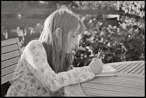 Girl doing a crossword puzzle. Courtesy of Paul Morris aka Paul of Congleton @ www.flickr.com