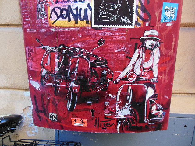 Roma Trastevere Alice Pasquini-C215 & Alice Artwork on Postal Box (Vespa Girl) - Rome, Italy - Courtesy of and pictured by Ittmust - Click here to see the original.