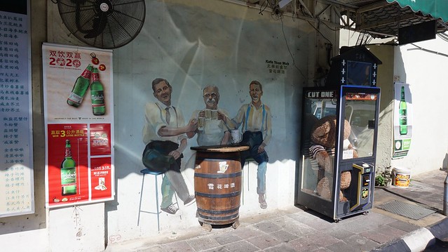 Street art - Men Drinking Beer - Ipoh, Perak, Malaysia.
